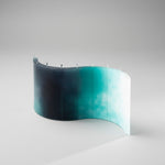 AQUA light blue sculptural candle with translucent wax finish