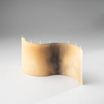 DUNE sand beige designer candle with sculptural wave silhouette