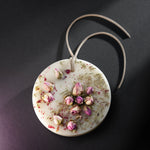 ESCLUSSO ROSE scented botanical wax sachet with natural pink rosebuds and botanical details embedded in ivory wax.